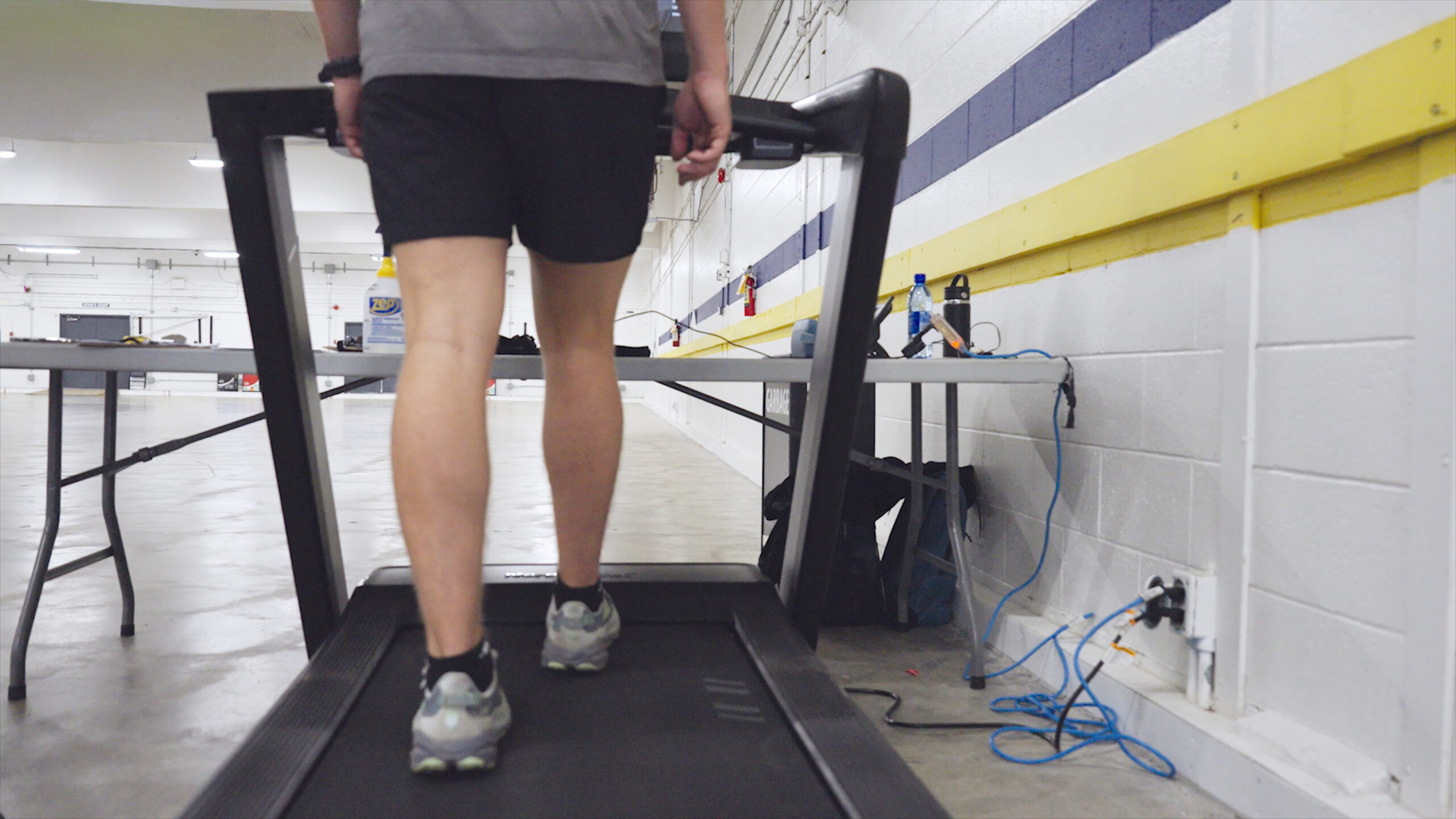 TreadmillWebStill A WFPAT1 test participant walking on a motorized treadmill.